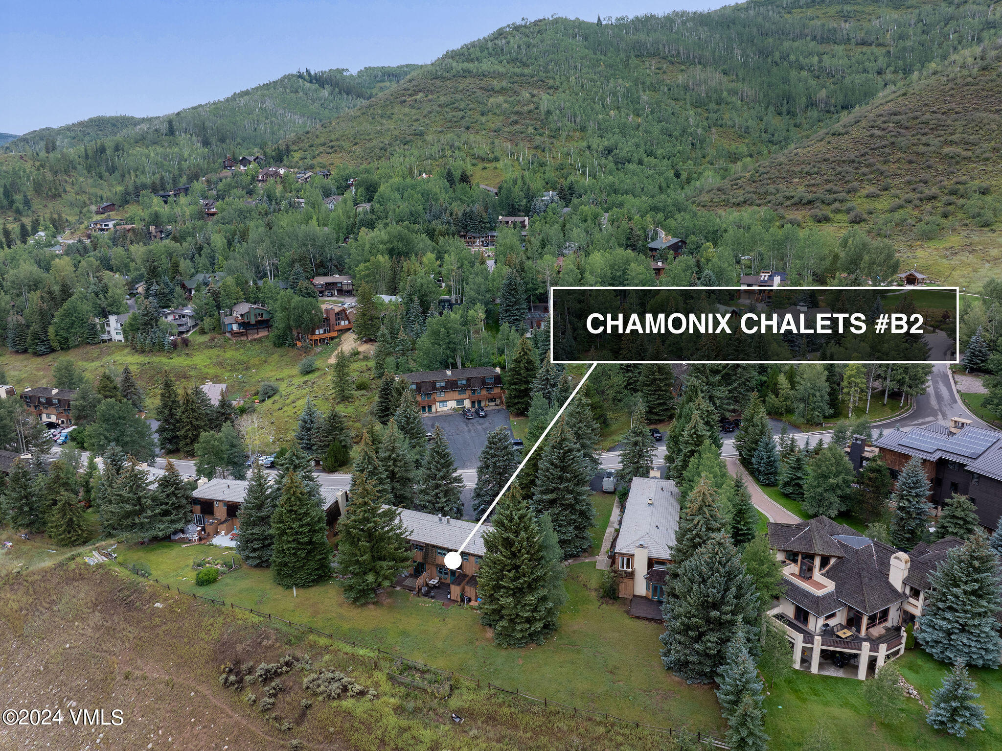 2456 Chamonix Lane, Unit B2 Vail, CO 81657 - Photo 17 of 18 an outdoor space with signage and flags