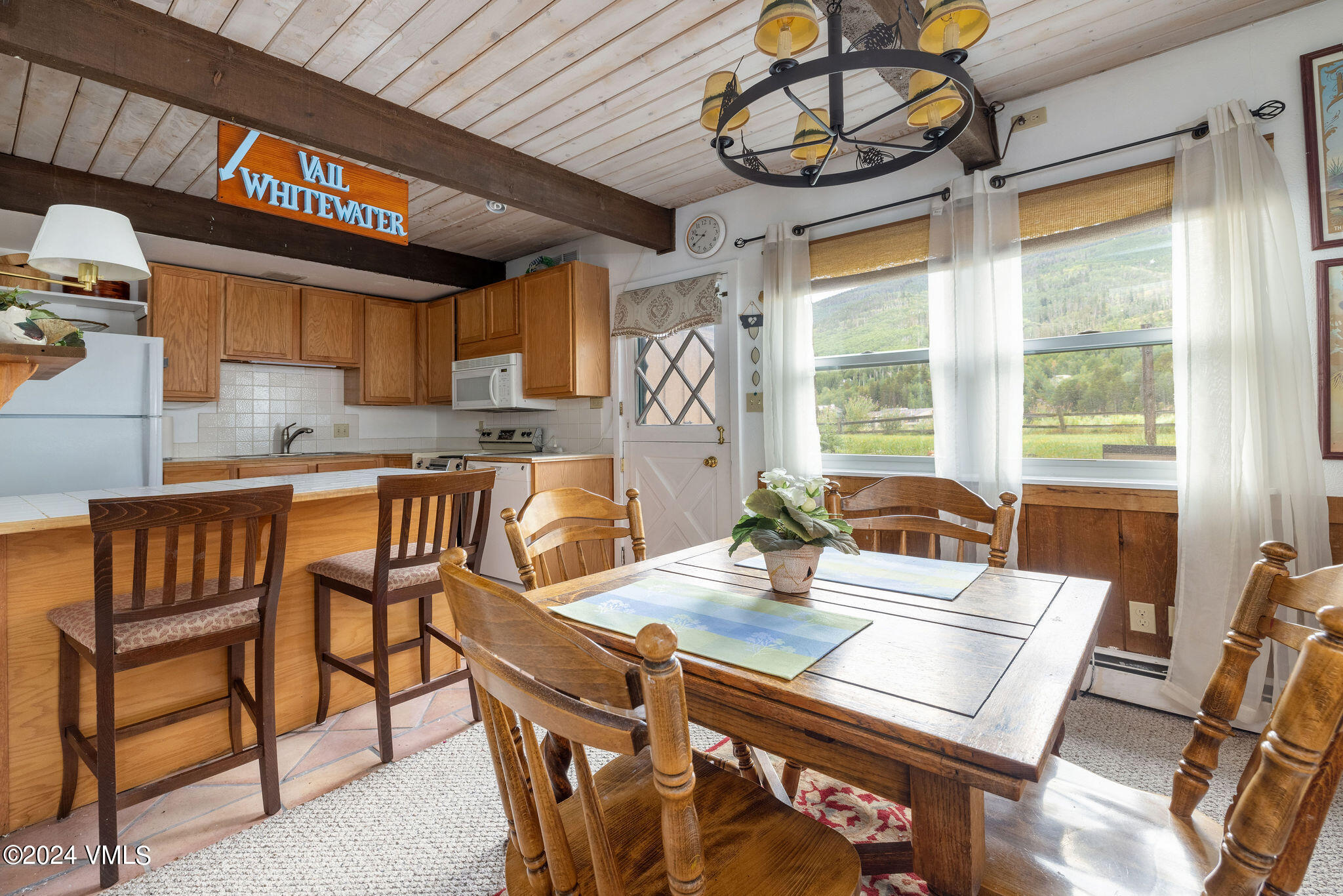 2456 Chamonix Lane, Unit B2 Vail, CO 81657 - Photo 7 of 18 a view of a dining room with furniture window and outside view