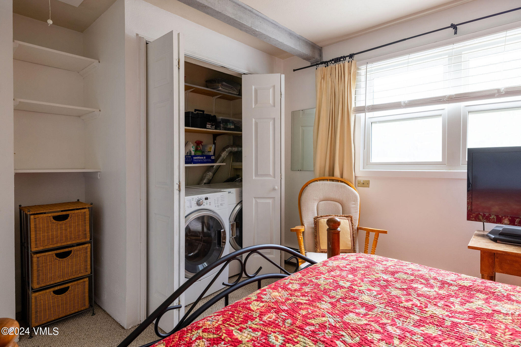 2456 Chamonix Lane, Unit B2 Vail, CO 81657 - Photo 9 of 18 a bedroom with a bed and a flat screen tv