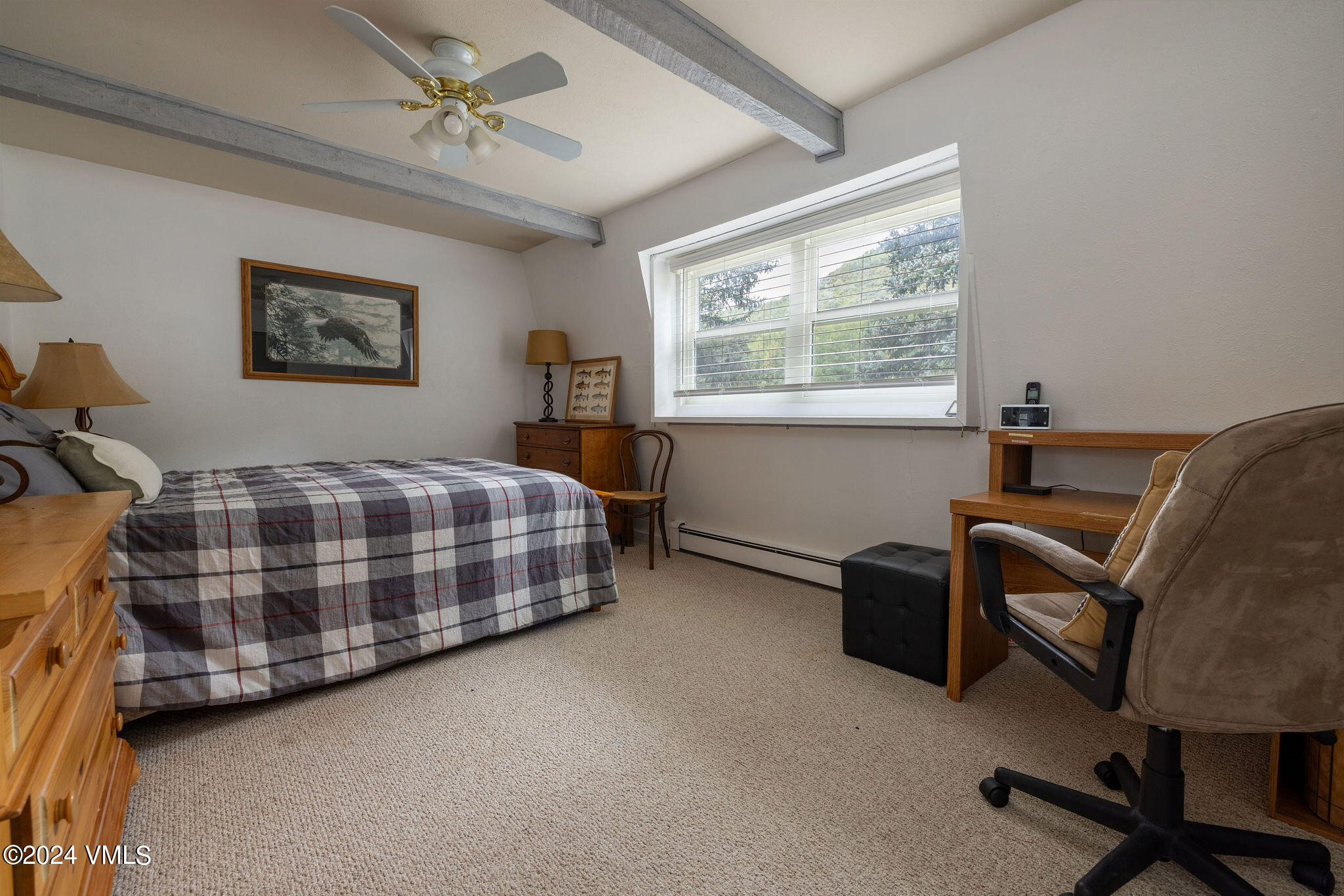 2456 Chamonix Lane, Unit B2 Vail, CO 81657 - Photo 10 of 18 a bedroom with a bed chair and window