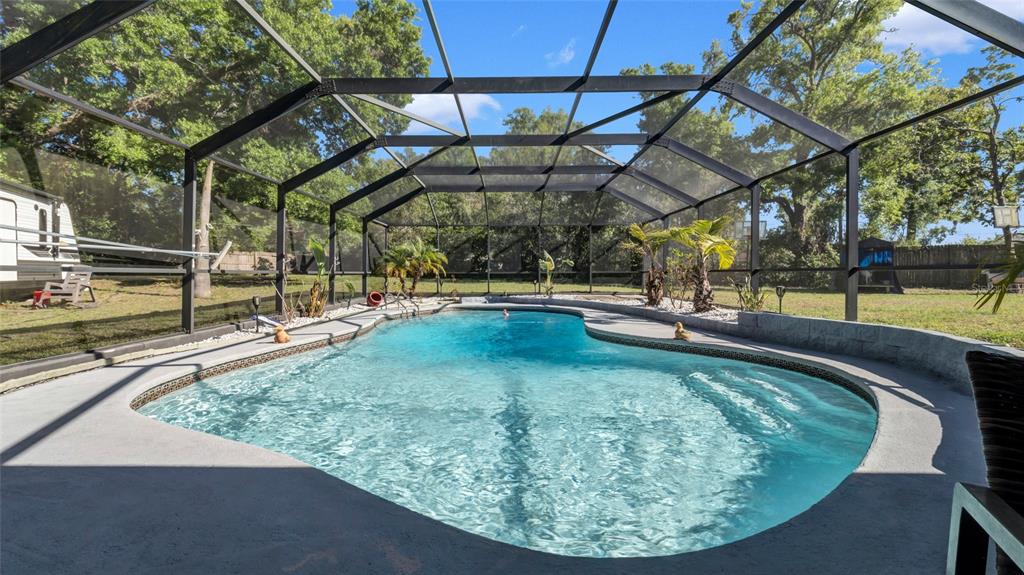 500 Hillpine Way Brandon, FL 33510 - Photo 32 of 39 a view of a swimming pool with a patio