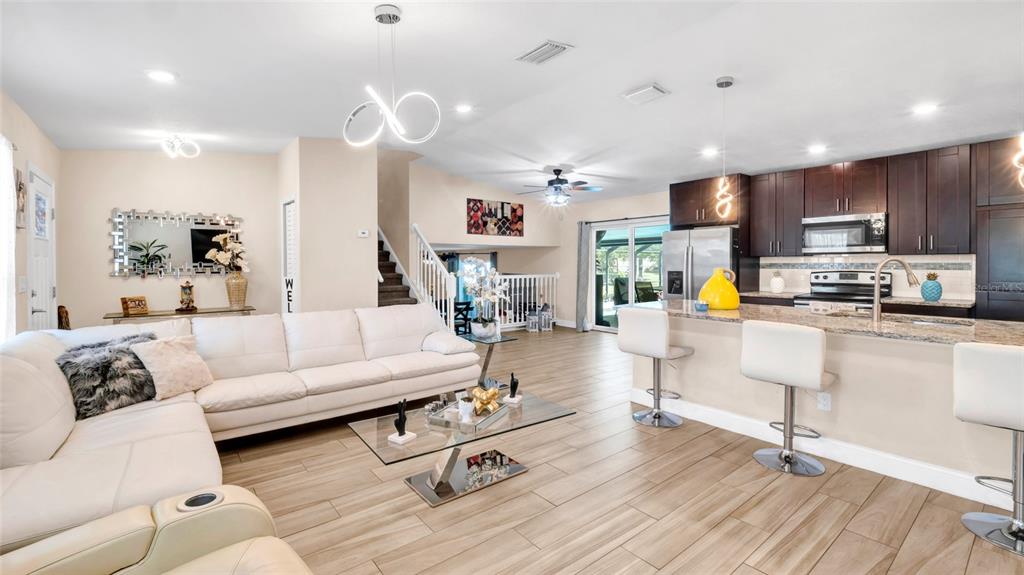 500 Hillpine Way Brandon, FL 33510 - Photo 6 of 39 a living room with furniture and kitchen view