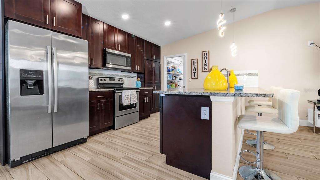 500 Hillpine Way Brandon, FL 33510 - Photo 8 of 39 a kitchen with stainless steel appliances a refrigerator and a stove