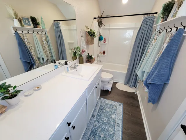 a bathroom with a double vanity sink mirror and double