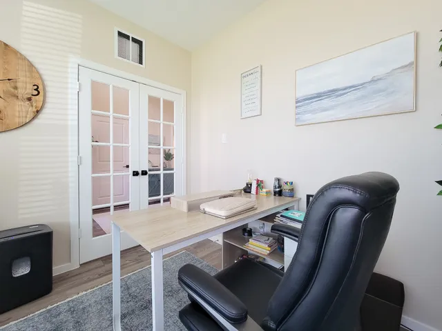 a living room with furniture and a potted plant