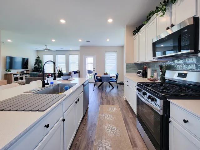 a view of a dining room with furniture and a window