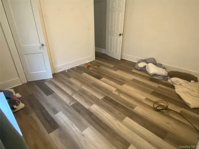 a bedroom with a bed and pillows