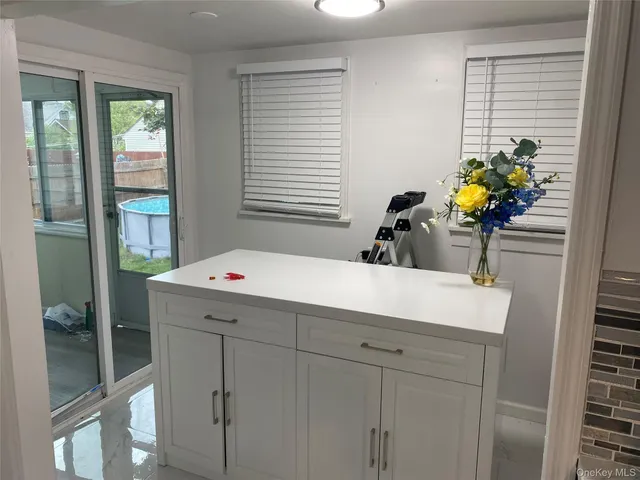 a bathroom with a sink a vanity and a mirror