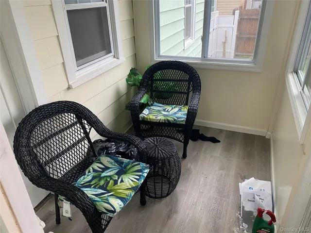 a view of staircase with furniture and wooden floor