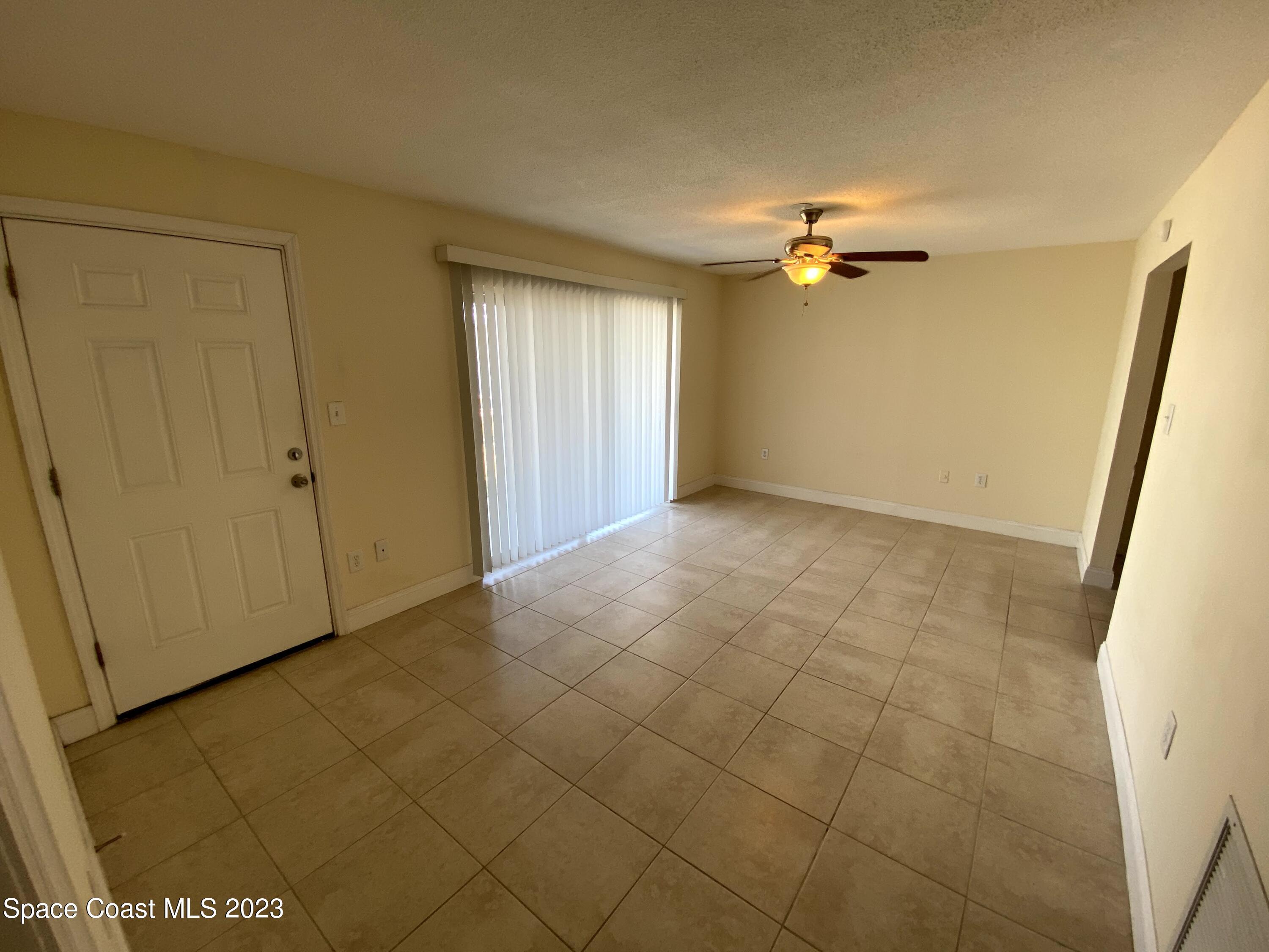 304 Buchanan Avenue, Unit 2 Cape Canaveral, FL 32920 - Photo 3 of 7 a view of a room with an empty space