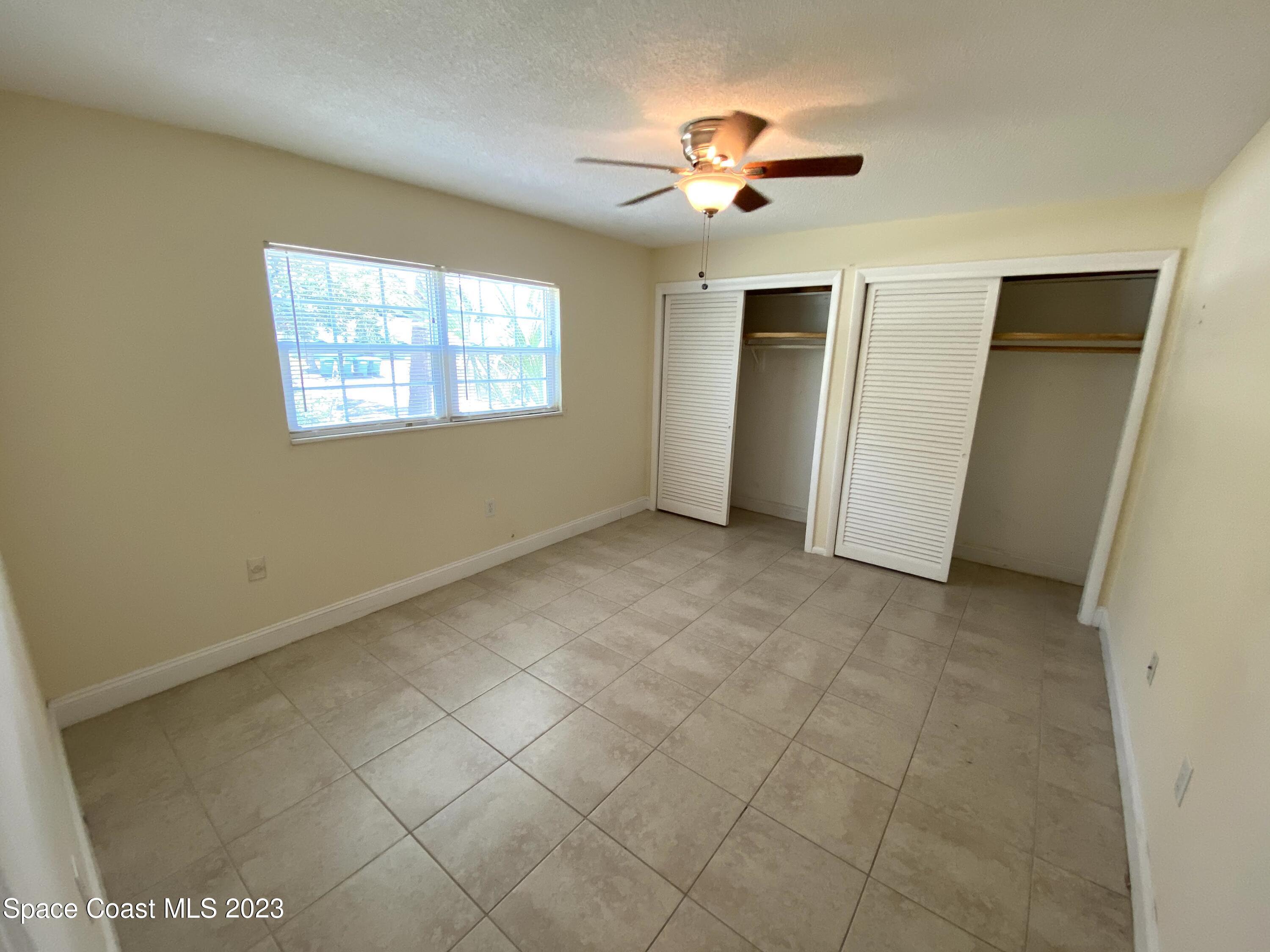 304 Buchanan Avenue, Unit 2 Cape Canaveral, FL 32920 - Photo 6 of 7 a view of an empty room with a window