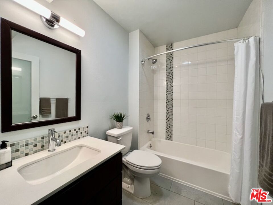 1920 Hillcrest Road, Unit 8 Los Angeles, CA 90068 - Photo 14 of 18 a bathroom with a sink toilet tub and shower
