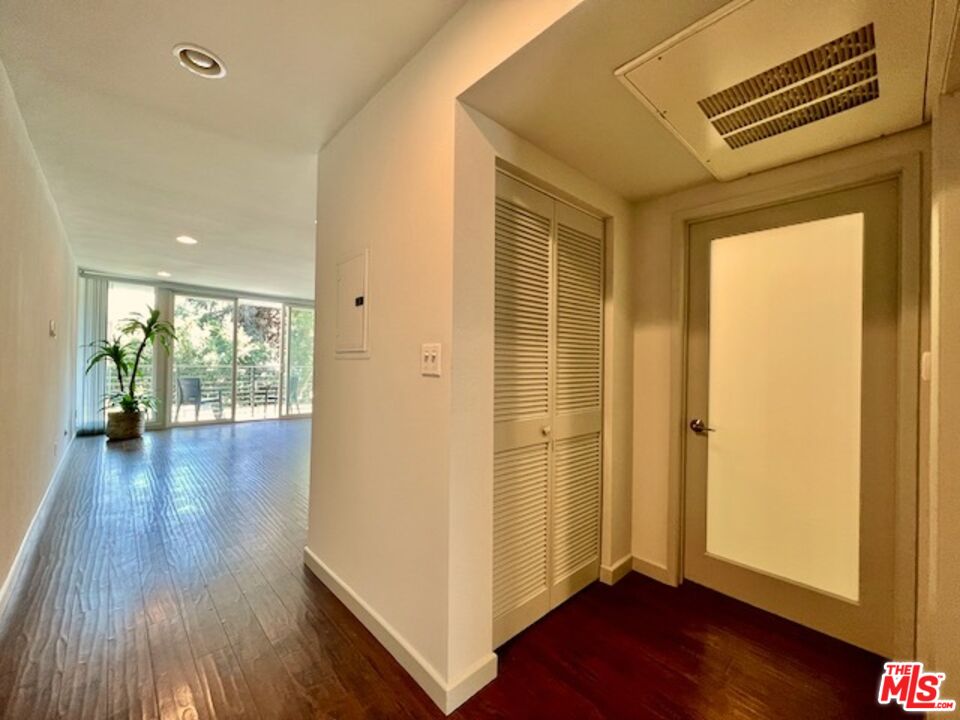 1920 Hillcrest Road, Unit 8 Los Angeles, CA 90068 - Photo 15 of 18 a view of a hallway with wooden floor