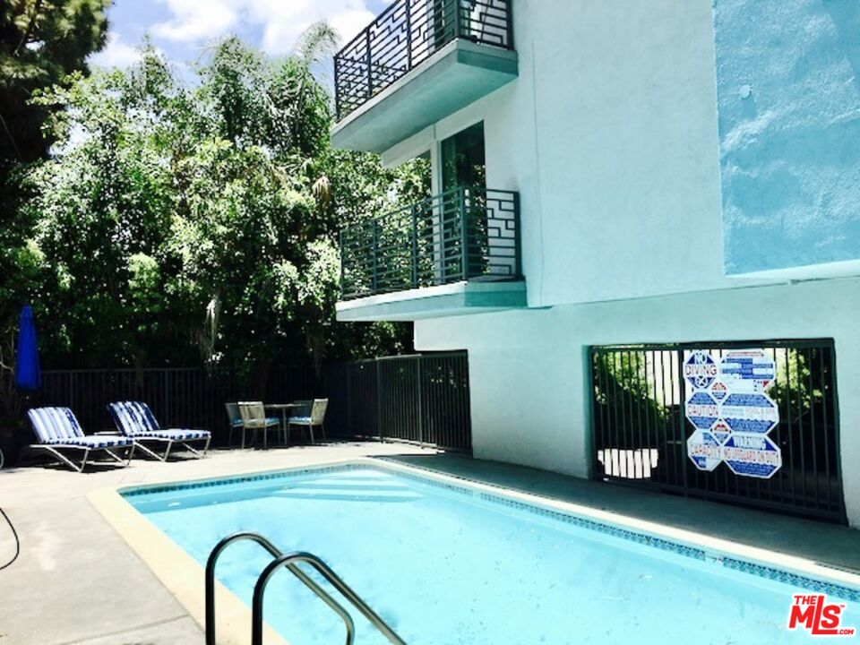 1920 Hillcrest Road, Unit 8 Los Angeles, CA 90068 - Photo 17 of 18 a front view of a house with garden