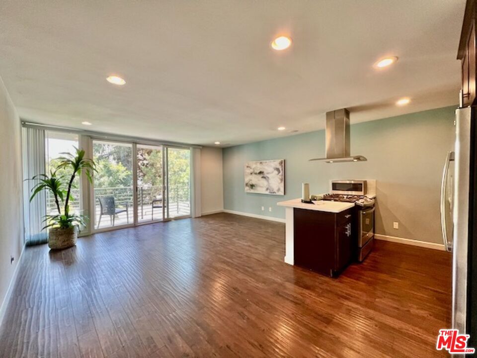 1920 Hillcrest Road, Unit 8 Los Angeles, CA 90068 - Photo 7 of 18 a kitchen with a sink and wooden floor