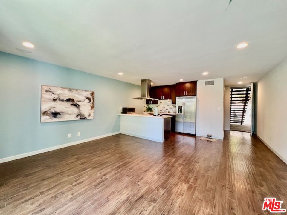 1920 Hillcrest Road, Unit 8 Los Angeles, CA 90068 - Photo 9 of 18 a view of a kitchen with wooden floor