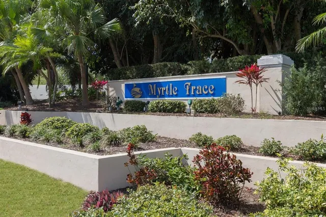 a view of a house with a swimming pool and a yard