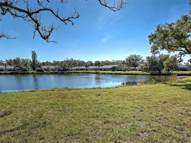 a view of a dining room with furniture wooden floor and chandelier