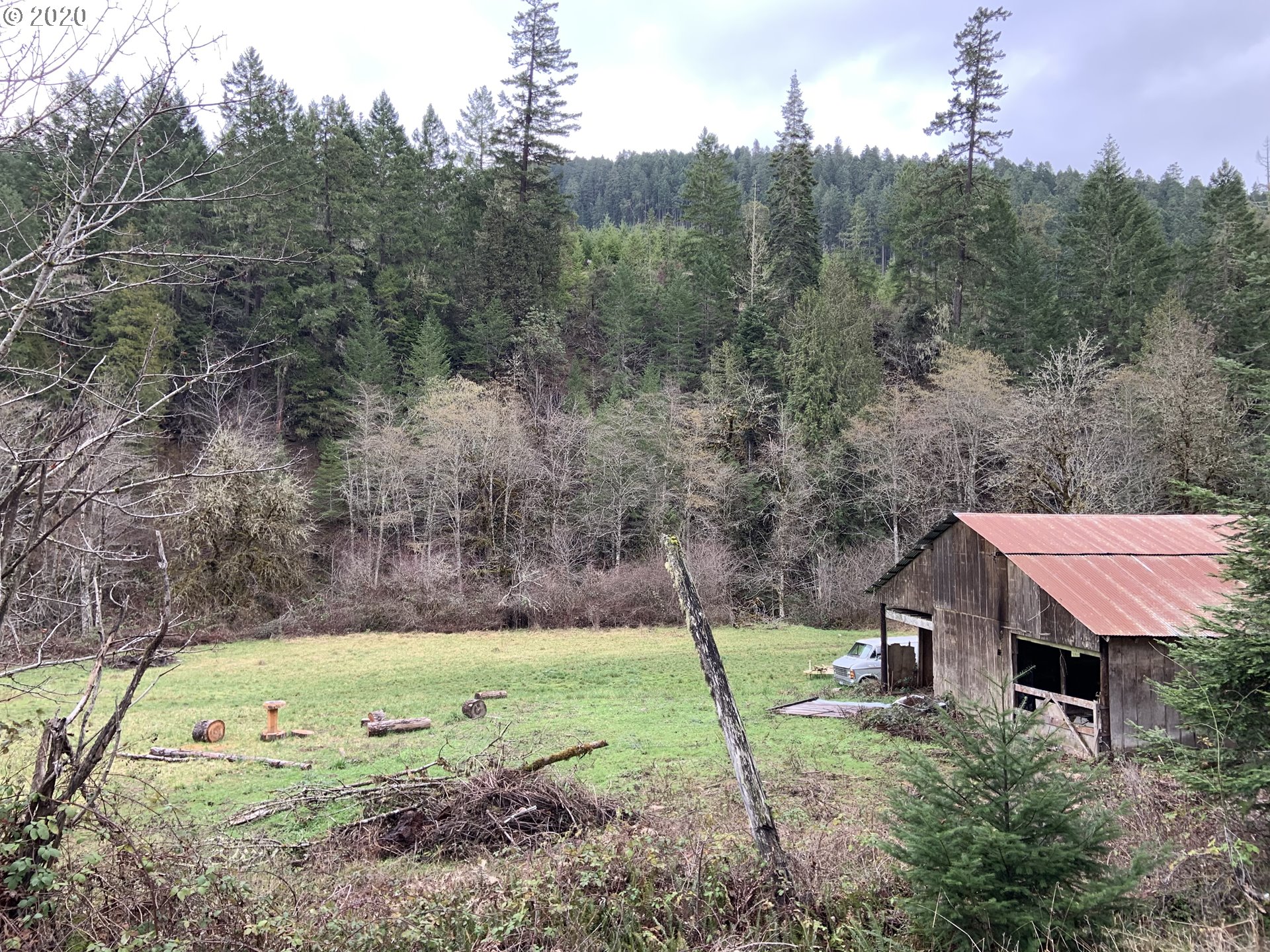 9995 Upper Olalla Road Winston, OR 97496 - Photo 18 of 29 a view of a house with a yard