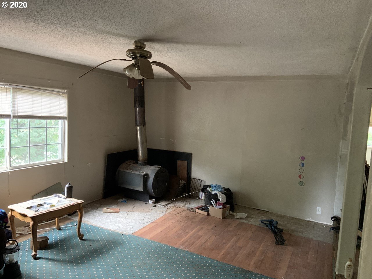 9995 Upper Olalla Road Winston, OR 97496 - Photo 25 of 29 a living room with furniture a dining table and a window