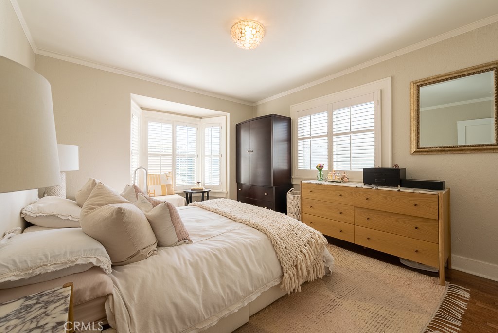 1601 Hi Point Street Los Angeles, CA 90035 - Photo 12 of 24 a bedroom with a bed and a dresser next to a window