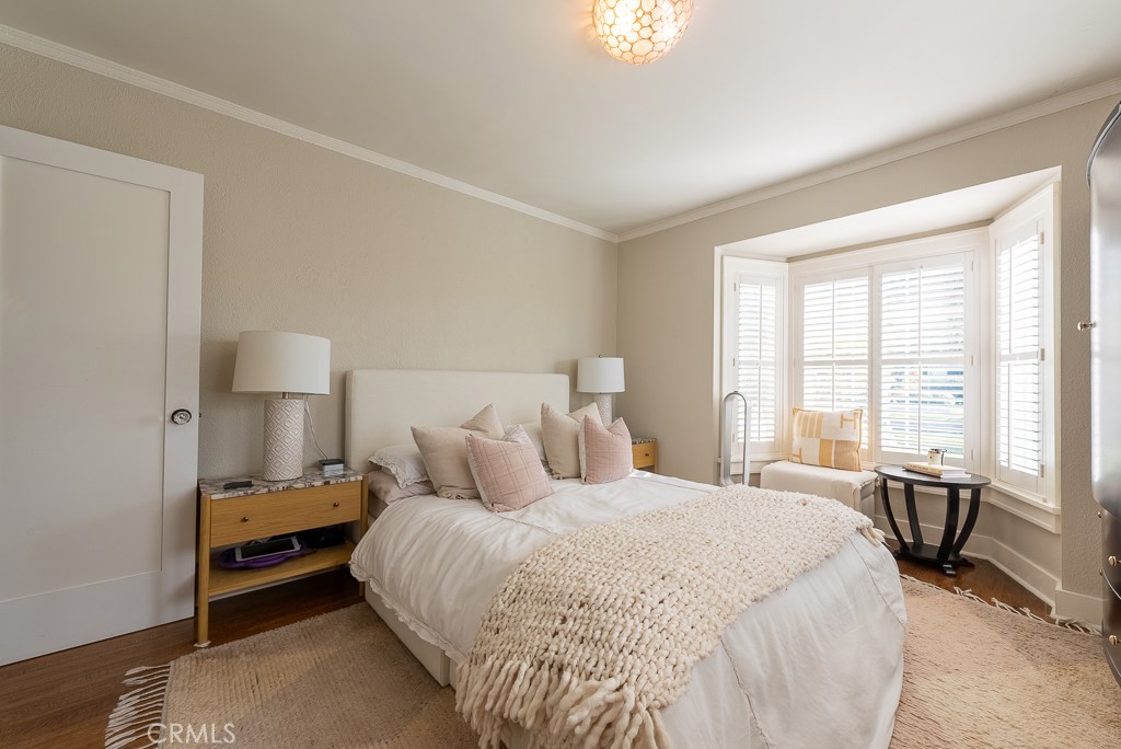 1601 Hi Point Street Los Angeles, CA 90035 - Photo 13 of 24 a bedroom with a bed and large windows
