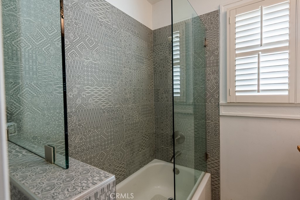 1601 Hi Point Street Los Angeles, CA 90035 - Photo 15 of 24 a bathroom with a tub and shower
