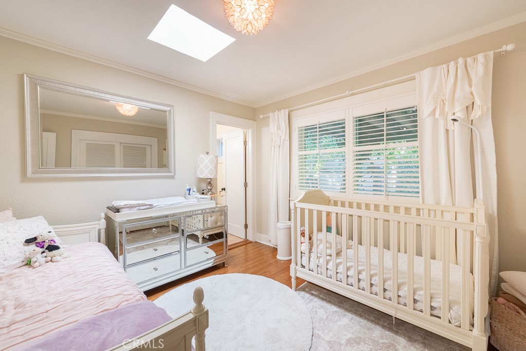 1601 Hi Point Street Los Angeles, CA 90035 - Photo 16 of 24 a bedroom with furniture and a window