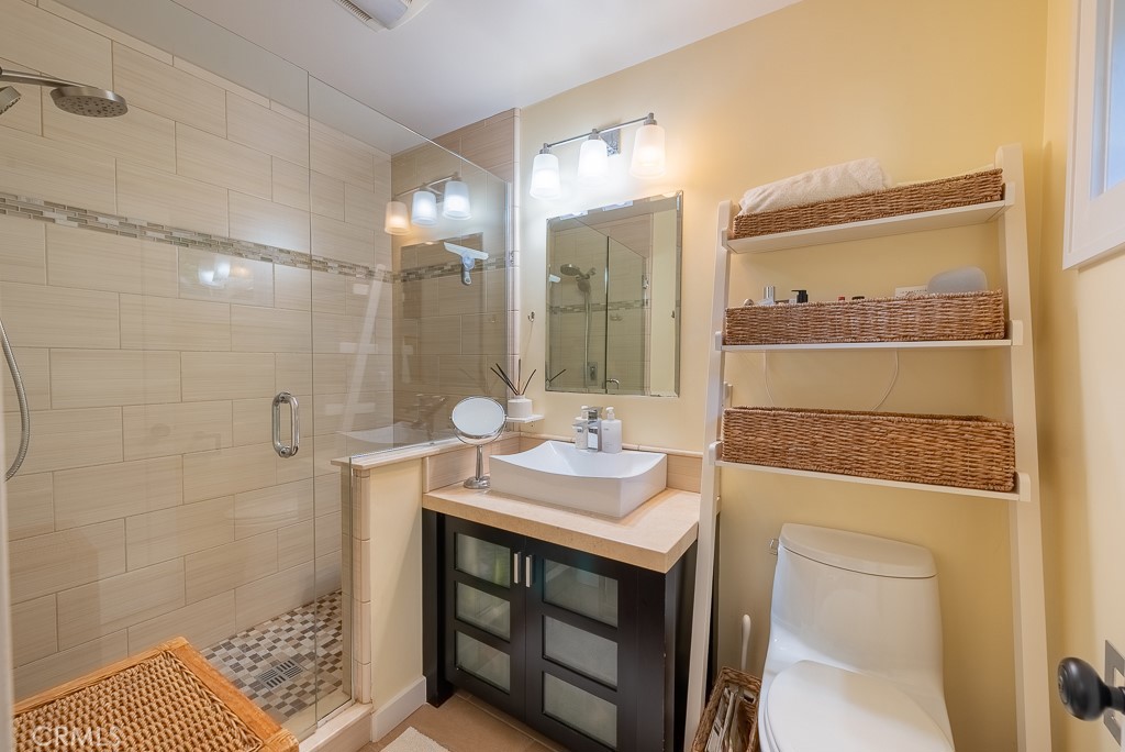 1601 Hi Point Street Los Angeles, CA 90035 - Photo 17 of 24 a bathroom with a sink a toilet and shower