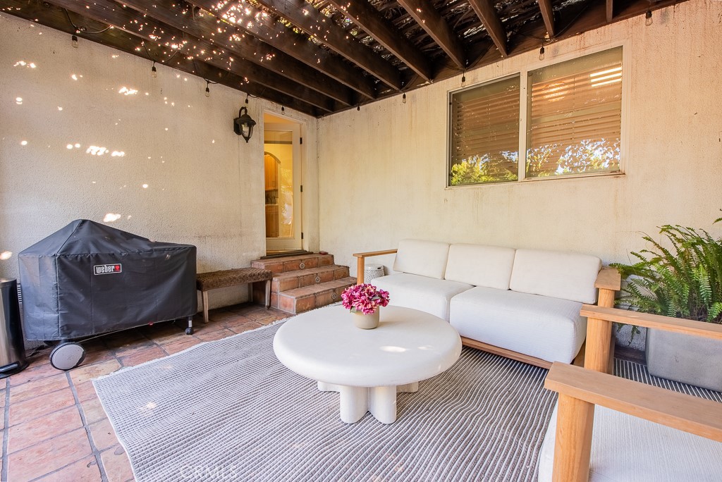 1601 Hi Point Street Los Angeles, CA 90035 - Photo 18 of 24 a living room with furniture and a potted plant