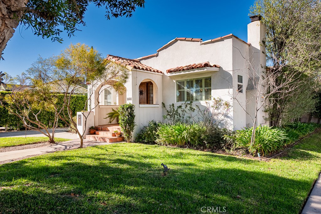 1601 Hi Point Street Los Angeles, CA 90035 - Photo 2 of 24 a front view of a house with garden