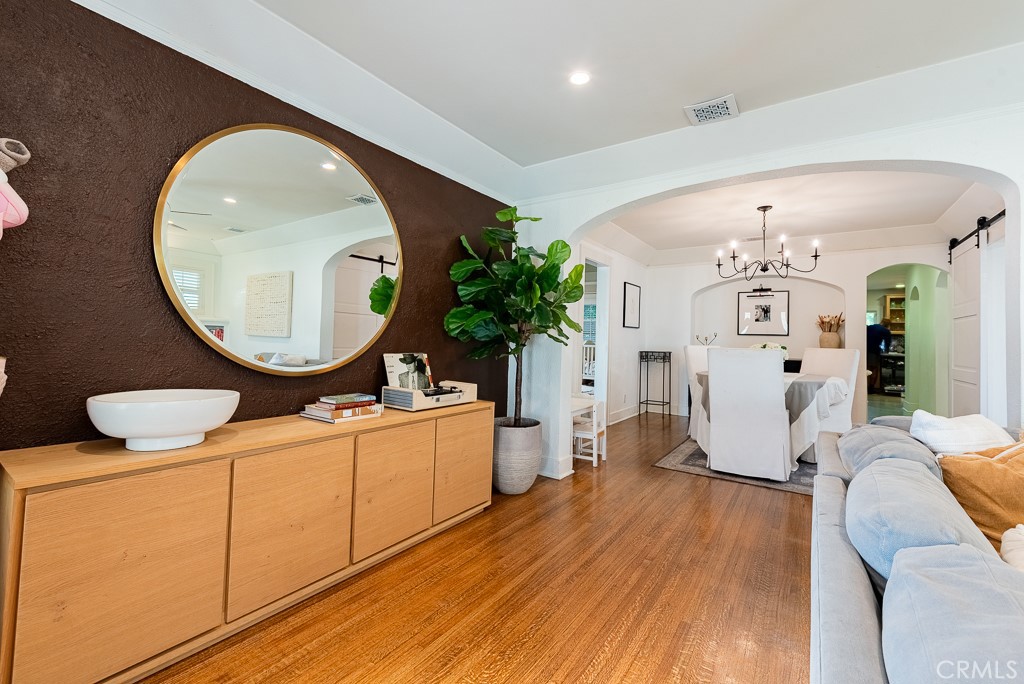 1601 Hi Point Street Los Angeles, CA 90035 - Photo 3 of 24 a living room with furniture and a mirror