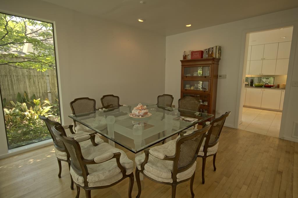 5108 Maple Springs Boulevard Dallas, TX 75235 - Photo 11 of 39 a view of a dining room with furniture and window