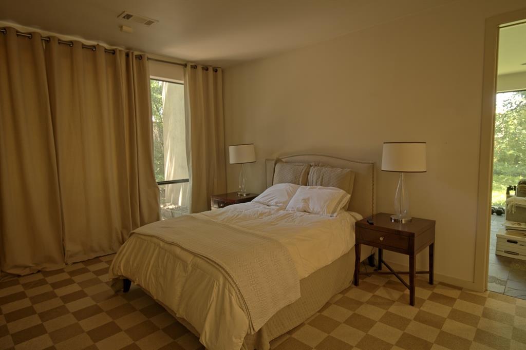 5108 Maple Springs Boulevard Dallas, TX 75235 - Photo 18 of 39 a bedroom with a bed and a window