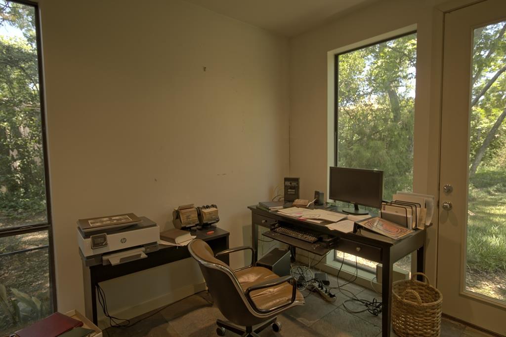 5108 Maple Springs Boulevard Dallas, TX 75235 - Photo 20 of 39 a view of a workspace with furniture and a window