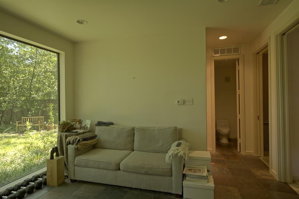 5108 Maple Springs Boulevard Dallas, TX 75235 - Photo 22 of 39 a living room with furniture and a large window