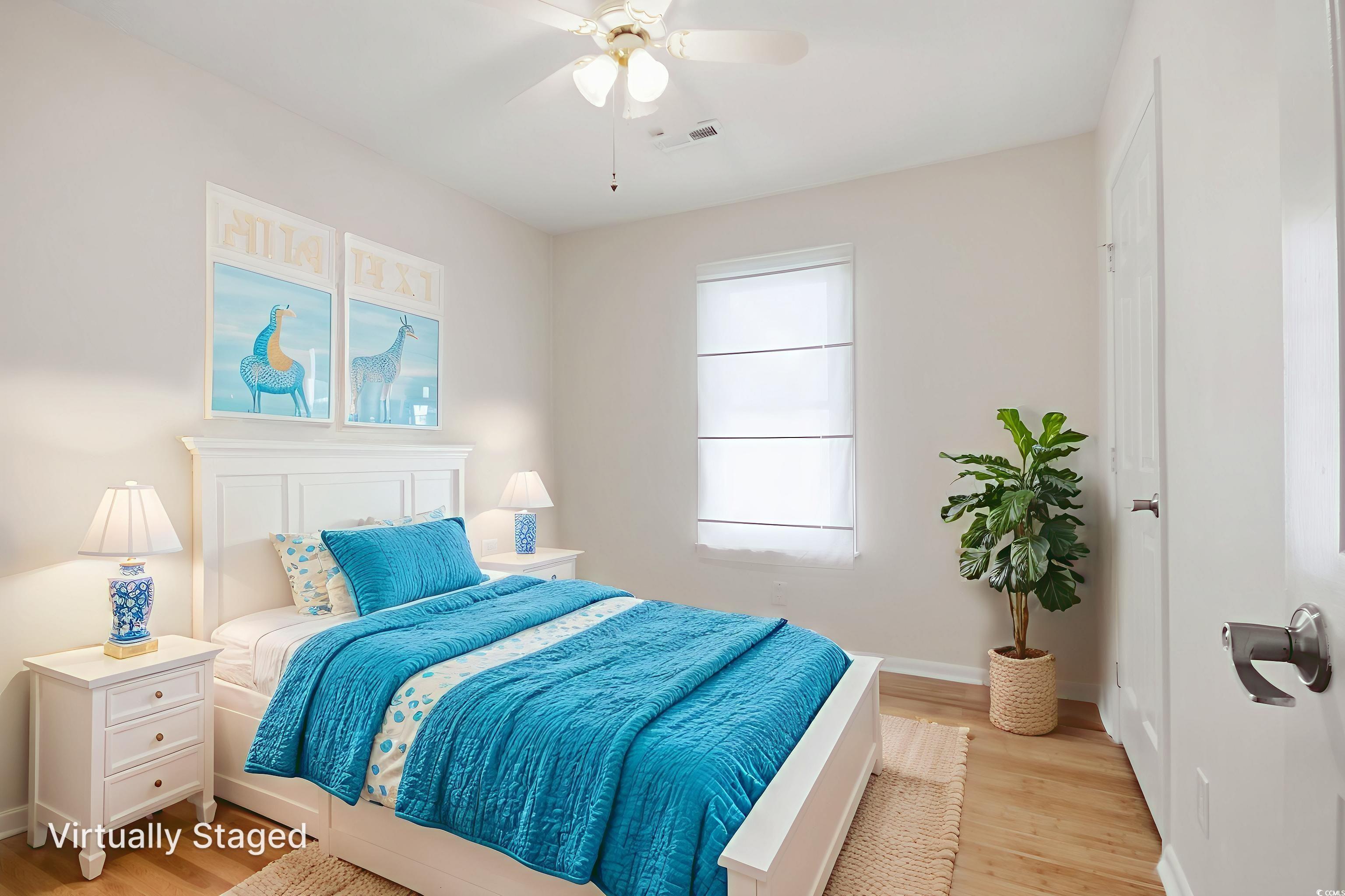 462 Bay Drive Murrells Inlet, SC 29576 - Photo 13 of 37 Empty room featuring plenty of natural light, light wood-type flooring, and lofted ceiling
