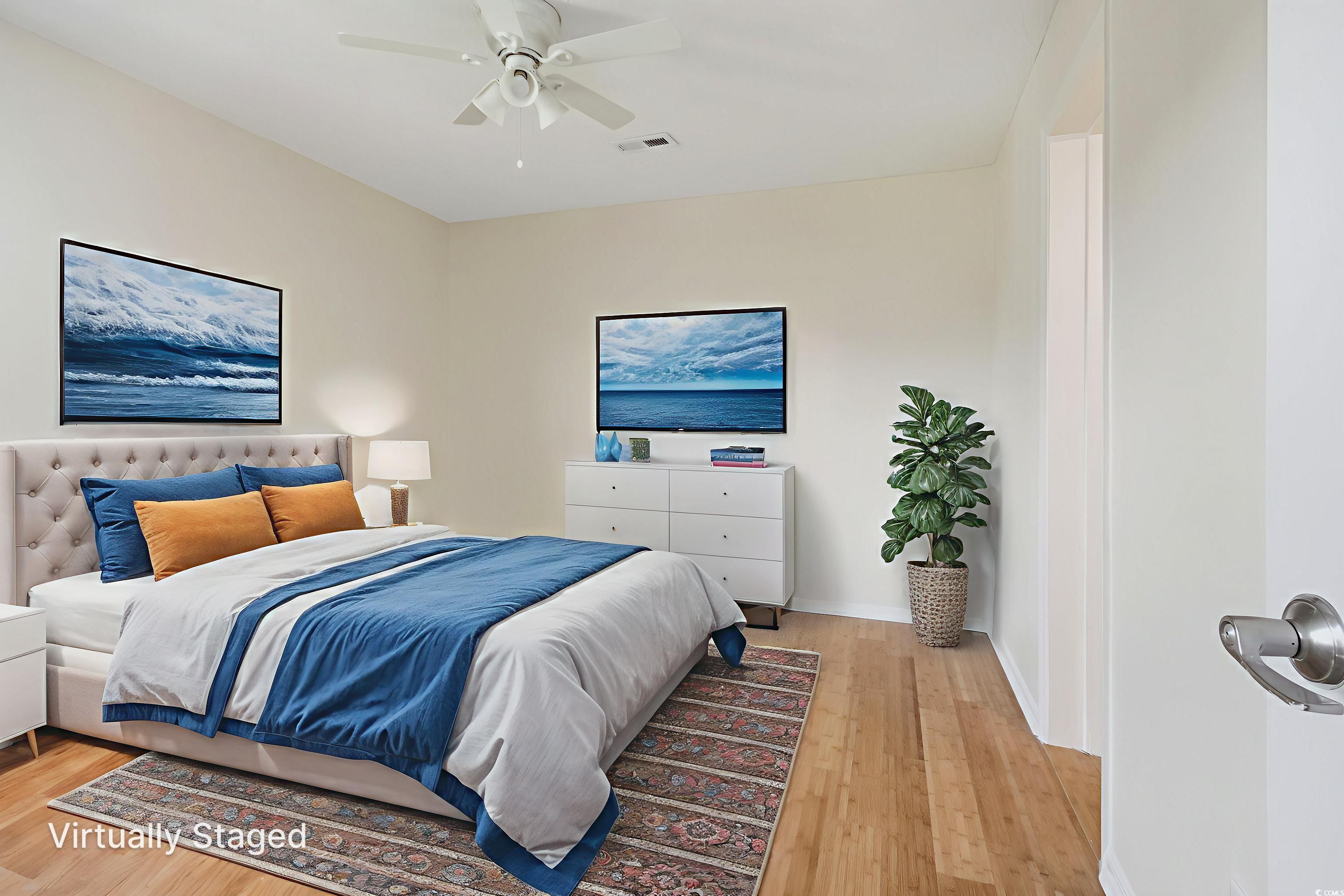 462 Bay Drive Murrells Inlet, SC 29576 - Photo 14 of 37 Bedroom with light wood-style flooring and a ceiling fan