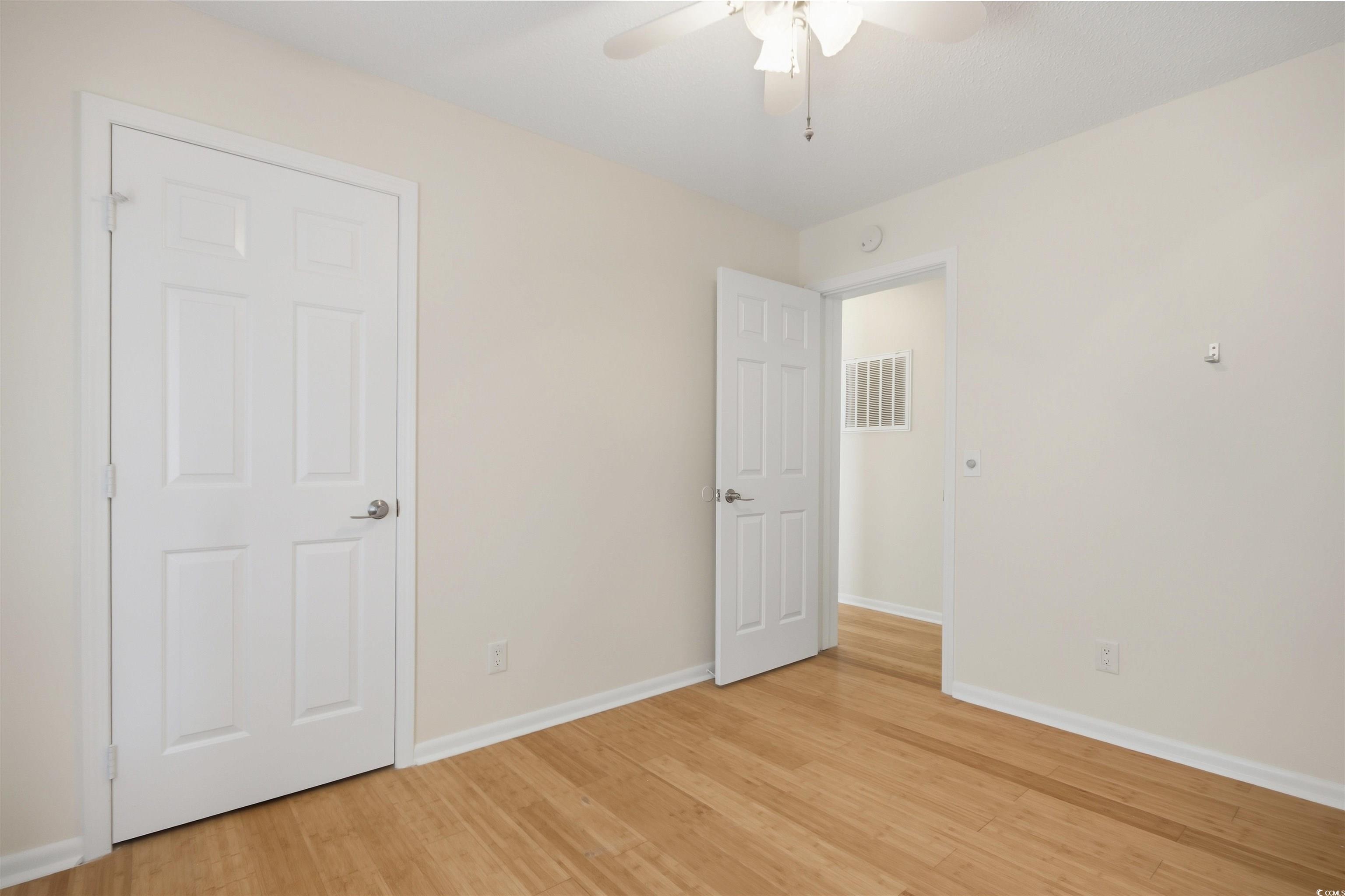 462 Bay Drive Murrells Inlet, SC 29576 - Photo 17 of 37 Spare room featuring light wood-type flooring and a ceiling fan