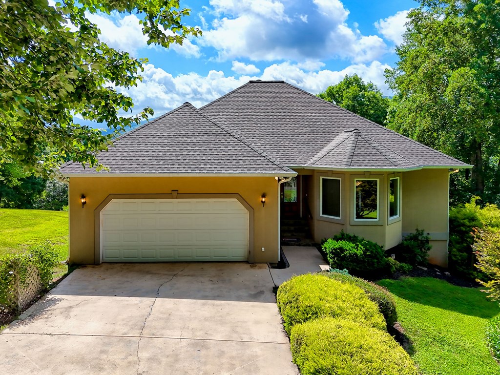 136 Elf School Road Hayesville, NC 28904 - Photo 3 of 84 a front view of a house with garden