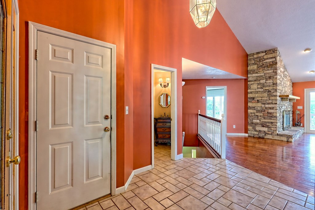 136 Elf School Road Hayesville, NC 28904 - Photo 36 of 84 a view of an entryway with wooden floor and a livingroom