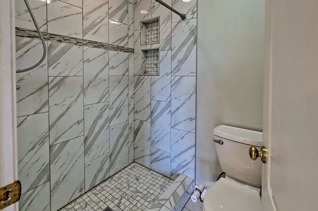 a view of a house with a yard and sitting area