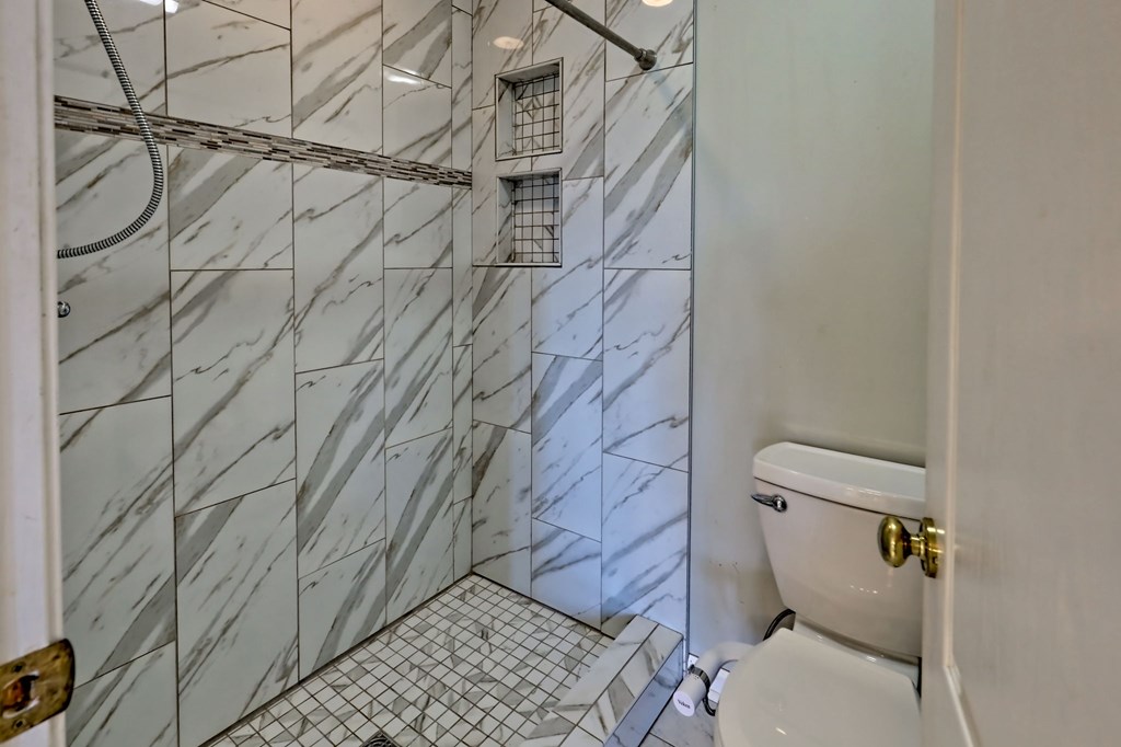 136 Elf School Road Hayesville, NC 28904 - Photo 43 of 84 a bathroom with a toilet and a shower