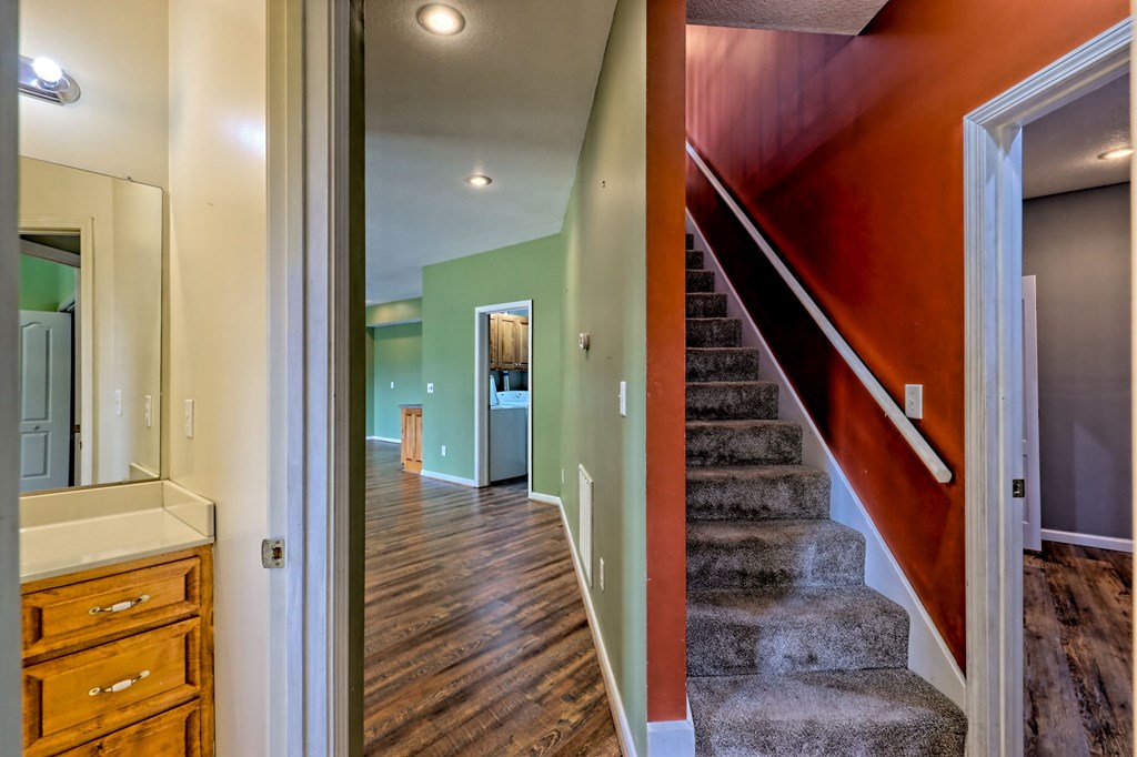 136 Elf School Road Hayesville, NC 28904 - Photo 51 of 84 a view of a hallway with wooden floor and staircase
