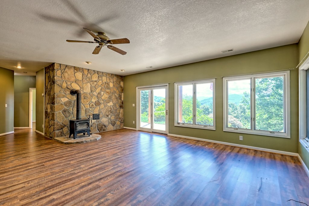 136 Elf School Road Hayesville, NC 28904 - Photo 55 of 84 a view of room with wooden floor and windows