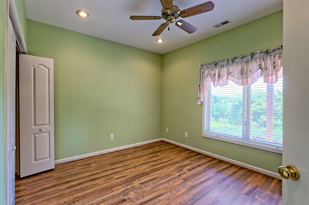 136 Elf School Road Hayesville, NC 28904 - Photo 61 of 84 a view of a room with a wooden floor and a window
