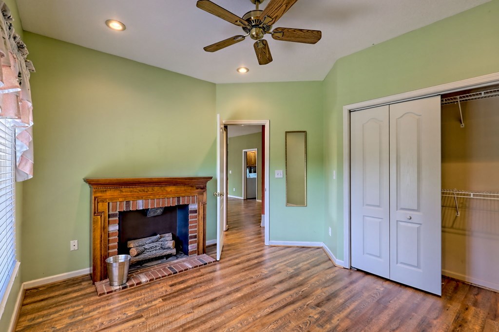 136 Elf School Road Hayesville, NC 28904 - Photo 62 of 84 a view of empty room with wooden floor and a fireplace