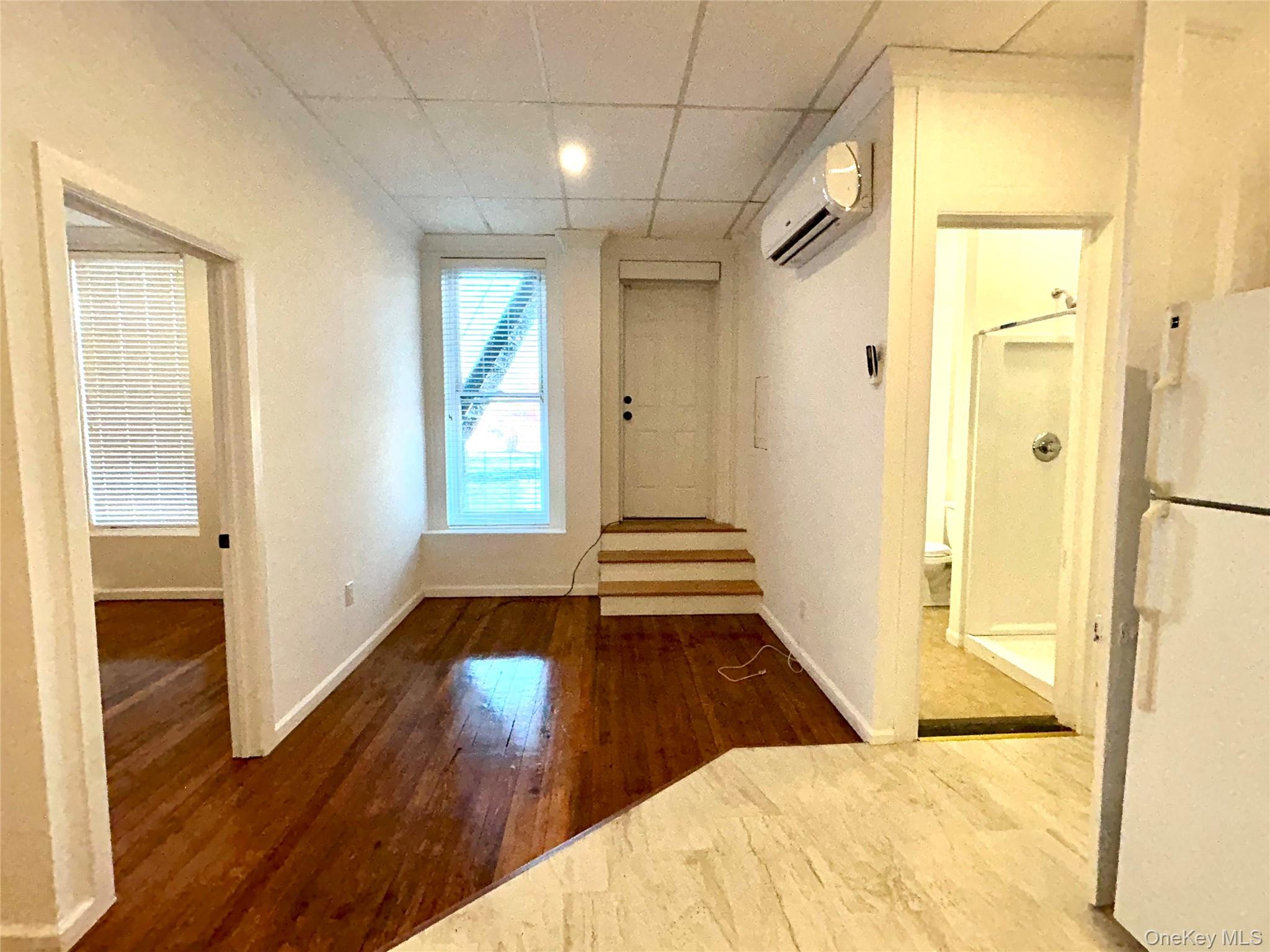 48 West Main Street Riverhead, NY 11901 - Photo 8 of 12 a view of a bathroom with a tub and windows