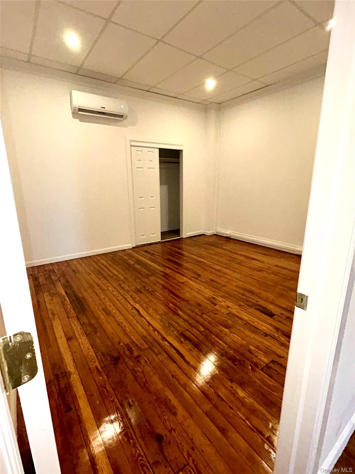 48 West Main Street Riverhead, NY 11901 - Photo 9 of 12 a view of empty room with wooden floor