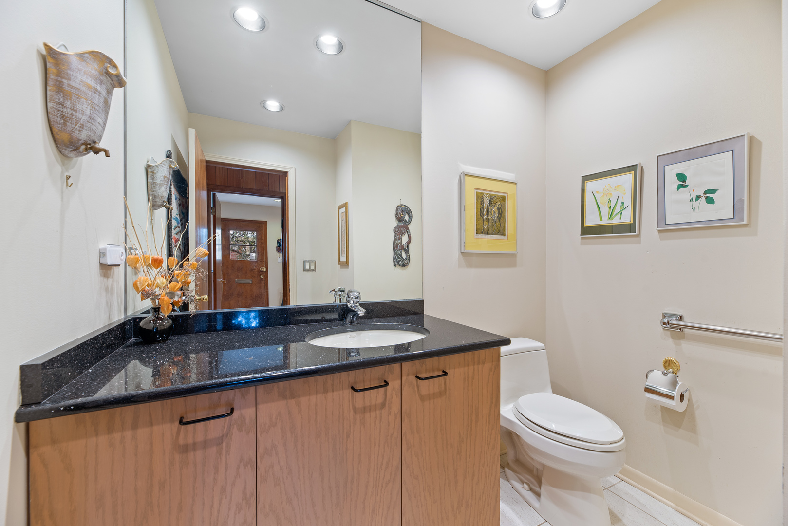 241 Ridge Road Highland Park, IL 60035 - Photo 13 of 31 a bathroom with a granite countertop sink a toilet and a mirror